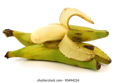 Fresh Still Unripe Plantain (baking) Banana And A Peeled One On A White Background