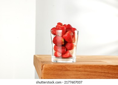 Fresh Strawberries On A Table With A Vacant Seat And Sunshine In The Morning