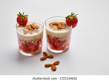 Fresh Strawberries With Soy Yoghurt, Oat Flakes, Almonds, Red Fruit Jam, Coconut Flour And Chia Seeds.