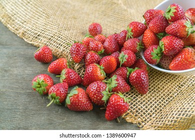 Fresh strawberry fruit on wood table.