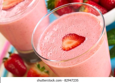 Fresh strawberry milkshake (Selective Focus, Focus on the front edge of the strawberry slice on the milkshake)