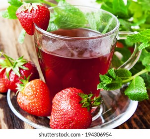 Fresh Strawberry Tea Cup With Mint Leaves