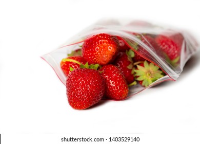 Fresh Strawberry In Transparent Open Plastic Bag With Lock Isolated On White. Storage. Convenience, Healthy Lifestyle