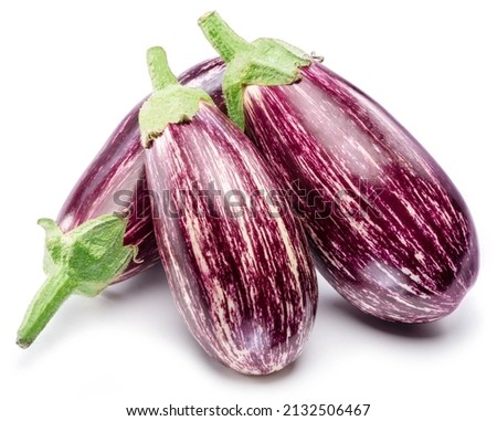 Fresh striped aubergines or eggplants with leaf and slices isolated on white background.