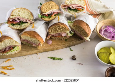 Fresh Sub Sandwich On White And Wheat Hoagies.