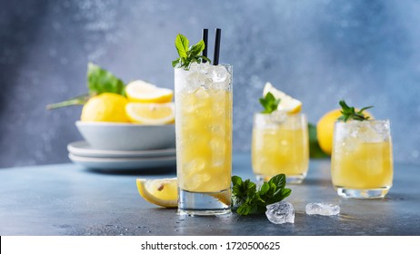 Fresh summer cocktail with lemons, mint and ice, selective focus image and slider format - Powered by Shutterstock