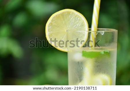 Similar – Infused fruit water cocktails and woman drinking green smoothie