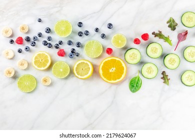 Fresh Summer Food. Fruit And Vegetable Slices, Overhead Flat Lay Shot On A White Marble Kitchen Table. Healthy Plant-based Diet, With Copy Space