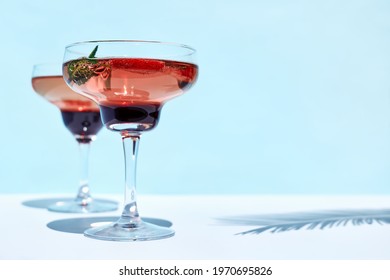 Fresh Summer Strawberry Cocktail Or Mocktail On The Table In The Garden. Creative Drink Beverage On Sunlight With Shadows.