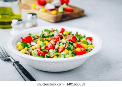 Fresh Summer Sweet Corn Salad Bowl With Tomatoes, Cucumbers, Red Onions And Parsley.