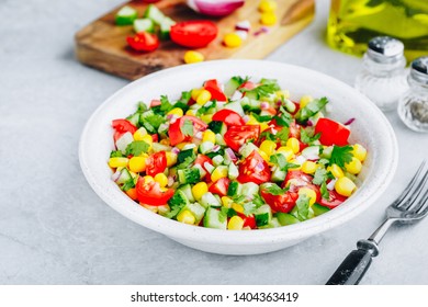 Fresh Summer Sweet Corn Salad Bowl With Tomatoes, Cucumbers, Red Onions And Parsley.