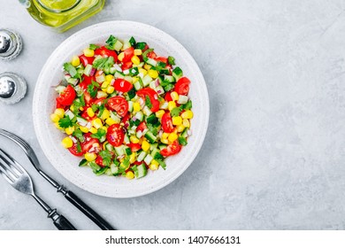 Fresh Summer Sweet Corn Salad Bowl With Tomatoes, Cucumbers, Red Onions And Parsley. Top View