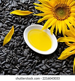 Fresh Sunflower Flower On A Background Of Black Seeds With A Bowl Of Sunflower Oil, Vegetable Oil By Cold Pressing. The Concept Of Vegetable Fats.