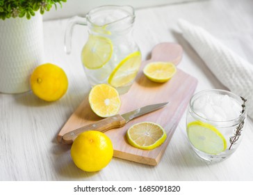 Fresh Sweet Lemonade Water; knife, wood and some plants