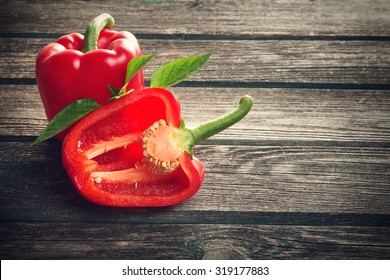 Fresh sweet red pepper on old wooden background - Powered by Shutterstock