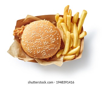 fresh tasty burger and french fries in paper box isolated on white background, top view