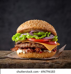 fresh tasty burger on wood table