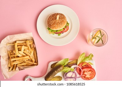 Fresh Tasty Burgers, French Fries Glass With Lemonade On Pink Background. Top View