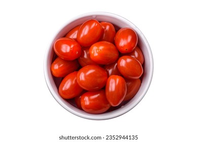 Fresh tasty cherry tomatoes in a white ribbed bowl on a dark concrete background - Powered by Shutterstock