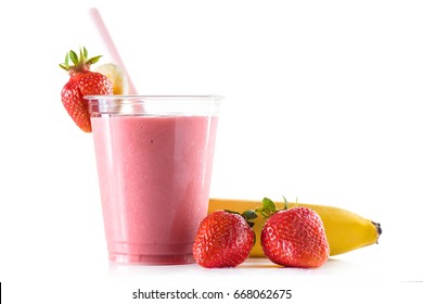 Fresh Tasty Strawberry Smoothie In Crystalline Glass With Pink Drinking Straw On Light Background. Strawberries And Banana Near The Plastic Cup