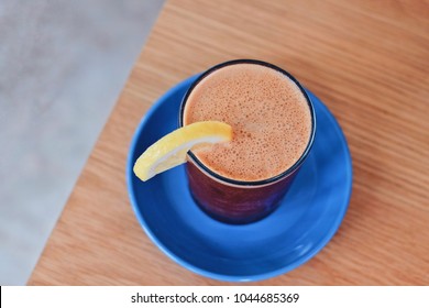 Fresh tasty summer drink : iced coffee with lemon in the cafe 