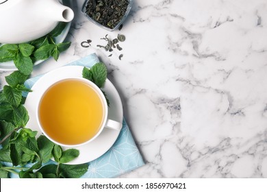 Fresh Tea With Mint On White Marble Table, Flat Lay. Space For Text