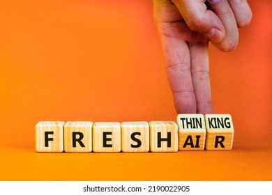 Fresh Thinking And Air Symbol. Businessman Turns Wooden Cubes, Changes Words Fresh Thinking To Fresh Air. Beautiful Orange Background. Copy Space. Business, Ecological, Fresh Thinking And Air Concept.