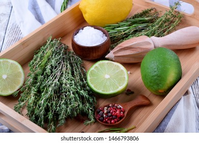 Fresh Thyme, Pepper Peas, Sea Salt And Lime On Wooden Tray. Ingredients For Making Marinade