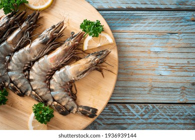 Fresh Tiger Prawn Or Shrimp On Wood Board