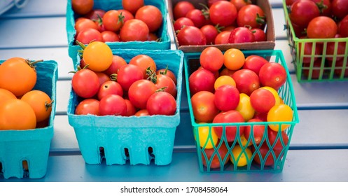 Fresh Tiny Tim Tomatoes At A Market 