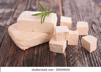 fresh tofu on table - Shutterstock ID 250549654