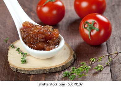 Fresh Tomato Chutney On Spoon With Thyme