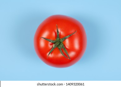 Fresh tomato. Tomato isolated on blue background - Powered by Shutterstock