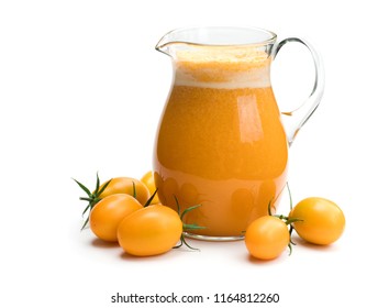 Fresh  tomato juice made from the golden-yellow tomatoes in jar isolated 