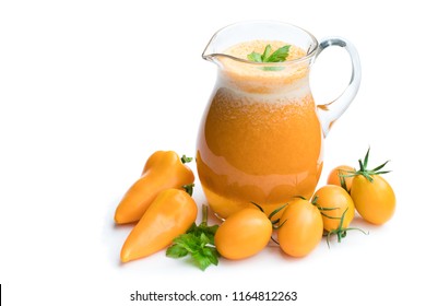 Fresh  tomato juice made from the golden-yellow tomatoes in jar isolated 