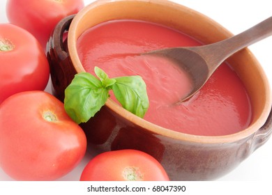 Fresh Tomato Sauce In A Terracotta Pot With A Basil Leaf