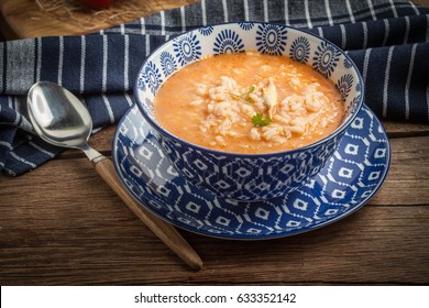 Fresh Tomato Soup With Rice In A Blue Bowl.