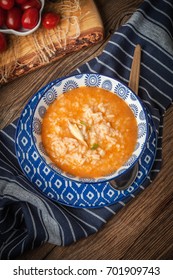 Fresh Tomato Soup With Rice In A Blue Bowl.