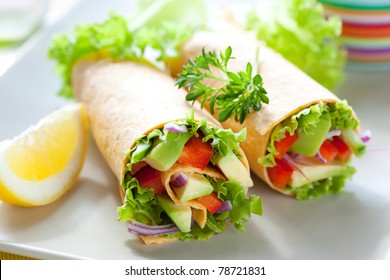 fresh  tortilla wraps with vegetables on the plate - Powered by Shutterstock