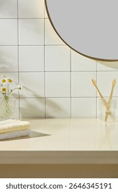 Fresh towel stack, toothbrushes, and small vase of daisies against white tiled wall. Bright daylight and clean counter emphasize simplicity and elegance in a serene bathroom setup.