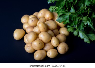 Fresh Triplets And Frizzy Parsley On Black Background