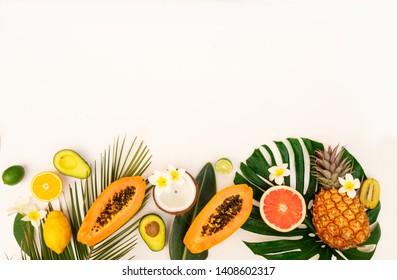 fresh tropical fruits with green tropical leves flat lay top view border, summer healthy diet background with copy space - Shutterstock ID 1408602317