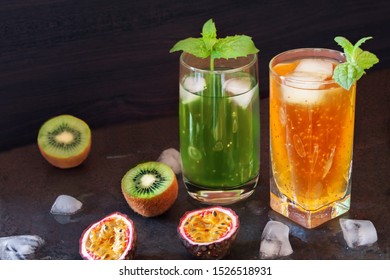 Fresh Tropical Maracuja And Kiwi Fruit Half Berries With Glass Natural Vegan Cocktail Juice With Chia Seeds For Healthy Vegetarian With Copy Space. Nonalcoholic Drinks For Sober Living Concept