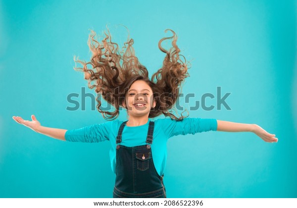 Fresh it up. Extra fresh dry shampoo. Strong and\
healthy hair concept. Nice and tidy hairstyle. Easy tips making\
hairstyle for kids. Small child long hair. Girl active kid with\
long gorgeous hair