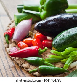 Fresh Vegetable Board - pepper, leek, onion, shallots, chili, plum tomatoes, chives, courgette, eggplant - fresh veggie box from the Farm shop .