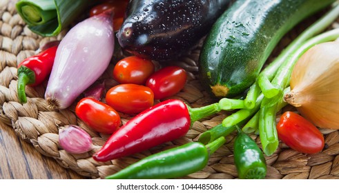 Fresh Vegetable Board - pepper, leek, onion, shallots, chili, plum tomatoes, chives, courgette, eggplant - fresh veggie box from the Farm shop .