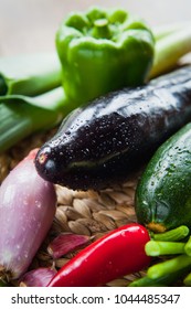 Fresh Vegetable Board - pepper, leek, onion, shallots, chili, plum tomatoes, chives, courgette, eggplant - fresh veggie box from the Farm shop .