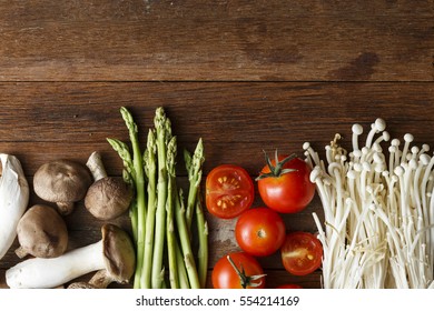 Fresh Vegetable Cooking Ingredients On Rustic Wooden Table