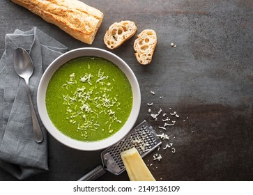 Fresh Vegetable Cream Soup With Parmesan Cheese On Grey Background Overhead Shoot.