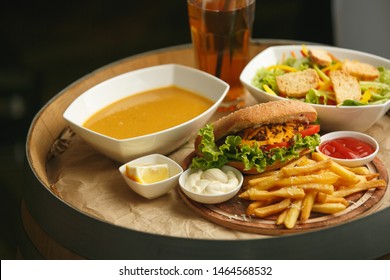 Fresh Vegetable Salad With Bread Beef Sandwich With French Fries Lentil Soup Soda